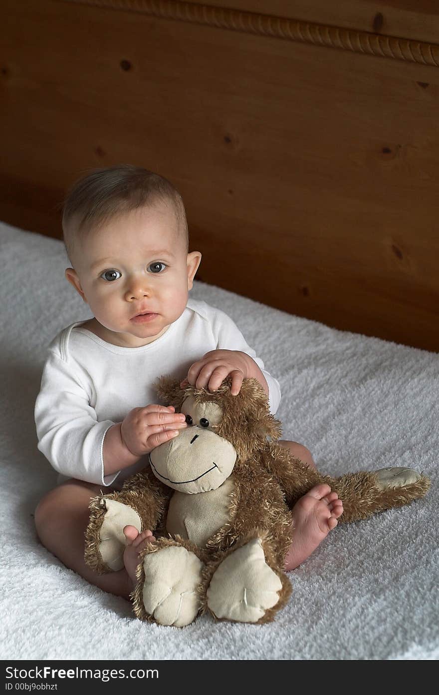 Image of baby holding a stuffed toy. Image of baby holding a stuffed toy