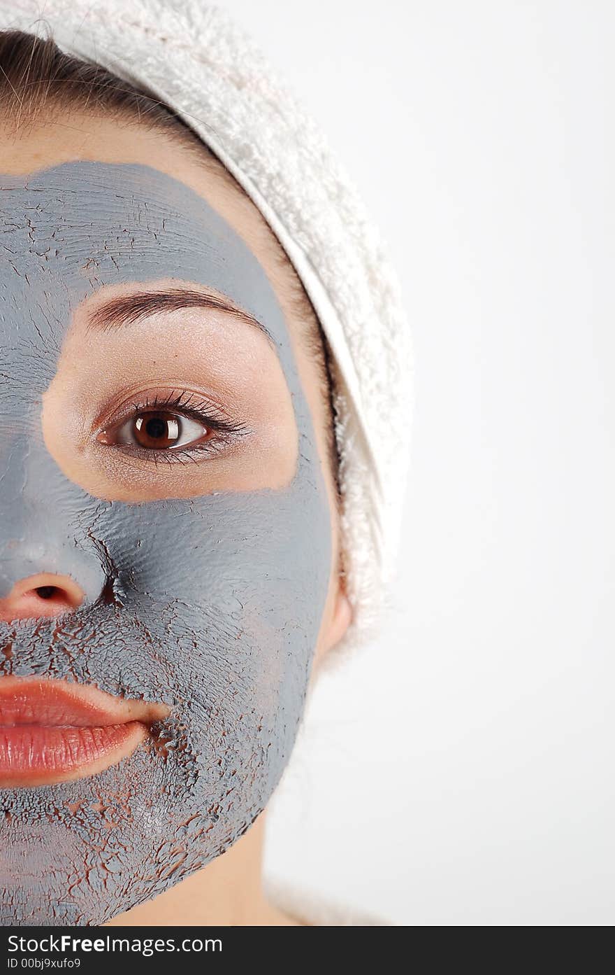 Attractive woman with blue beauty mask on white background. Attractive woman with blue beauty mask on white background