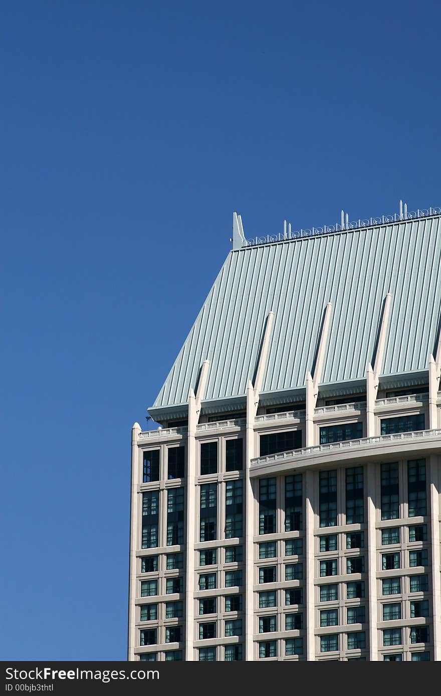 Modern skyscrapers against a bright blue sky