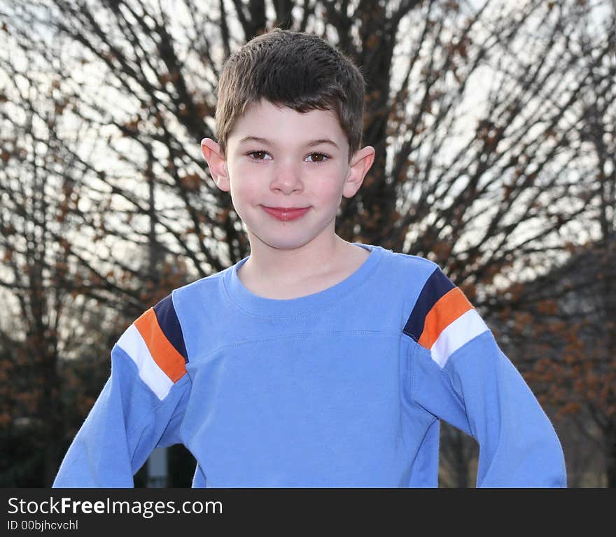 Happy boy in blue shirt outside - horizontal. Happy boy in blue shirt outside - horizontal.