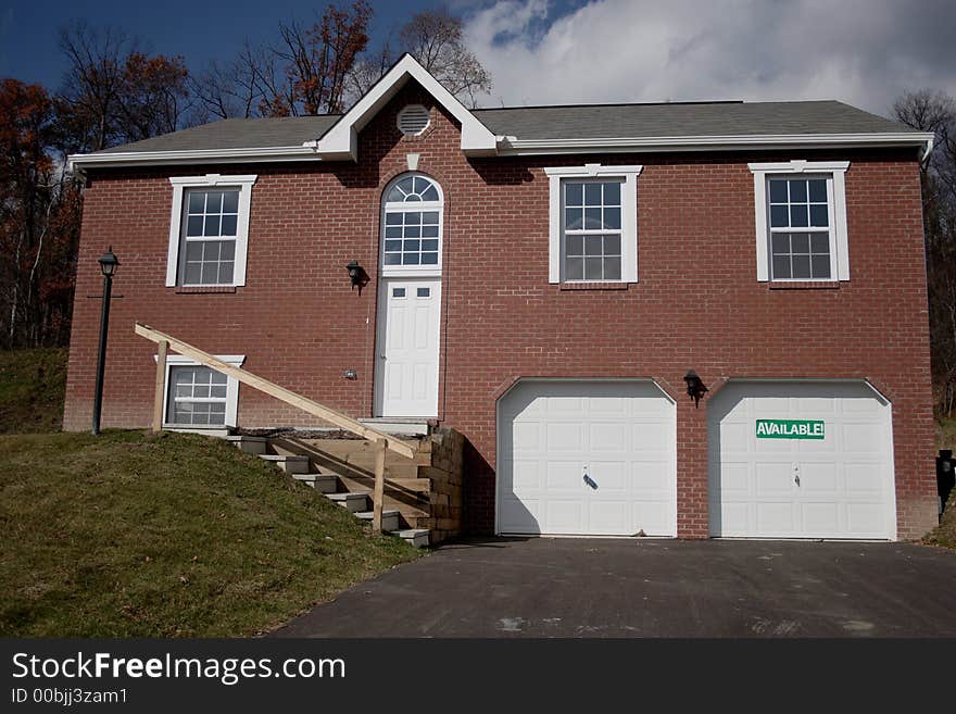 Multi Level Brick Home in suburbia that is available for sale.