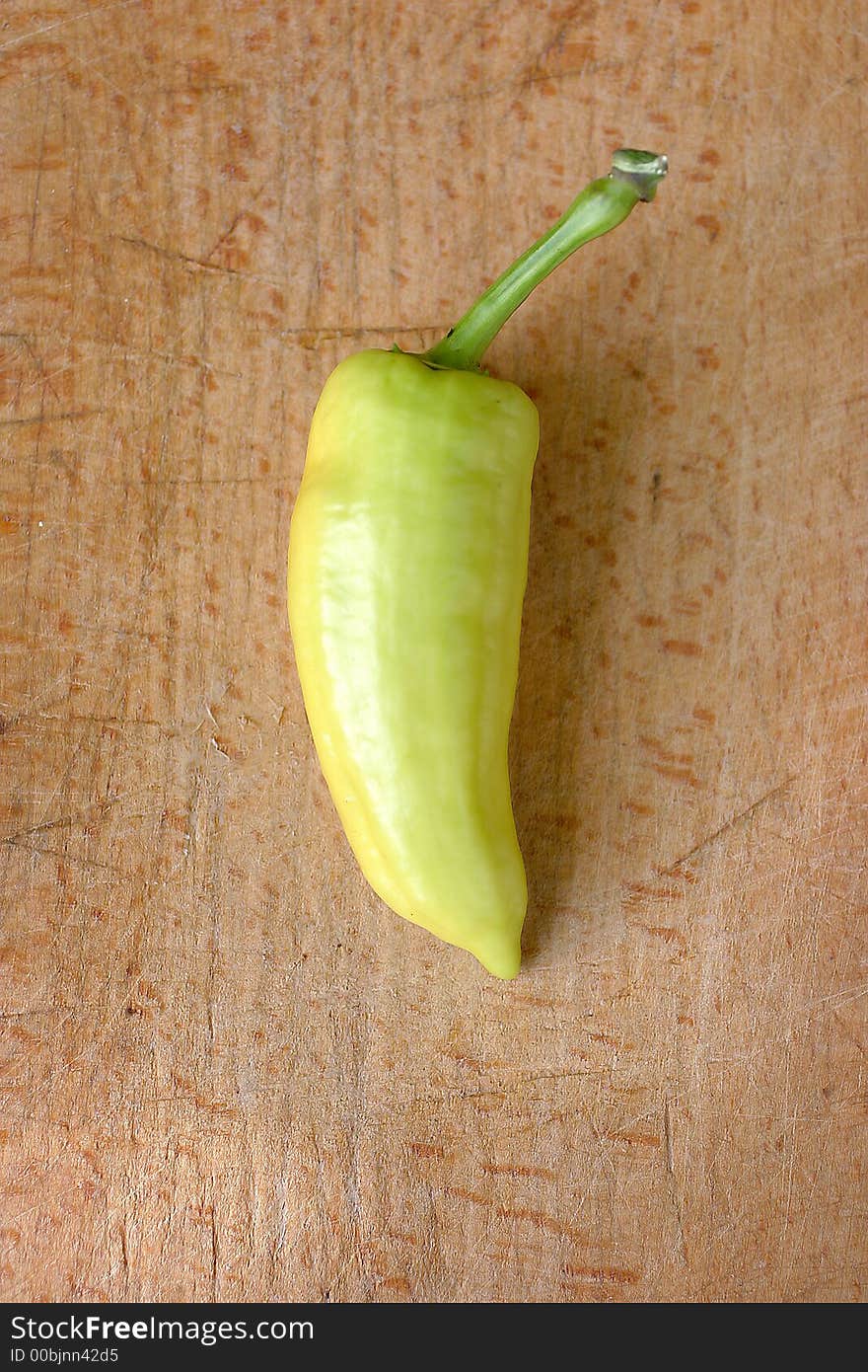 Green pepper on wood