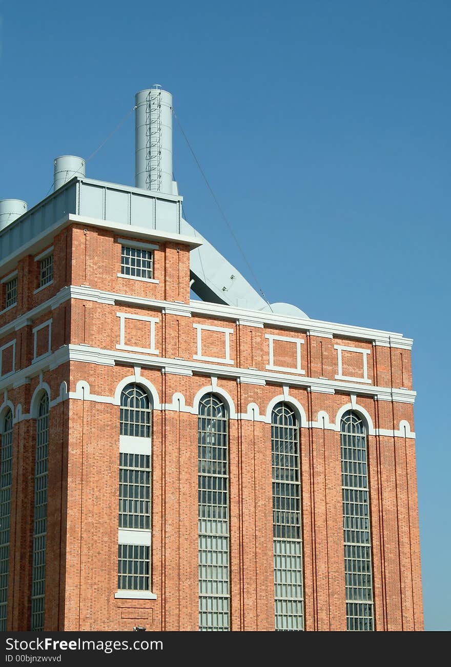 Perspective of old power plant with wall in brick