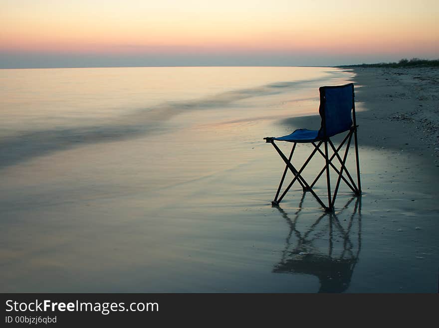 Folding chair on a seaside