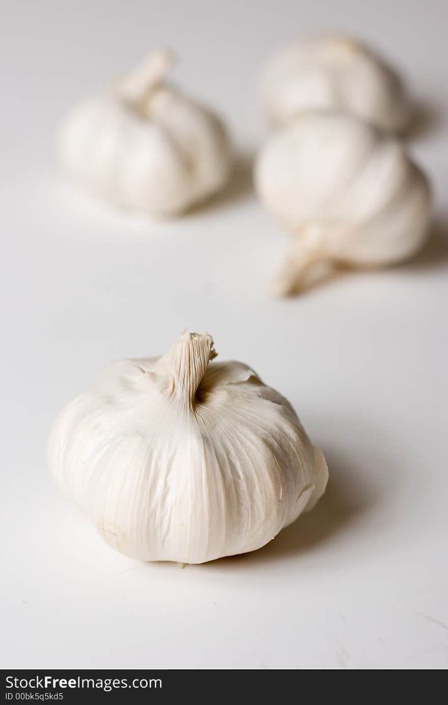 Four garlics ob white background