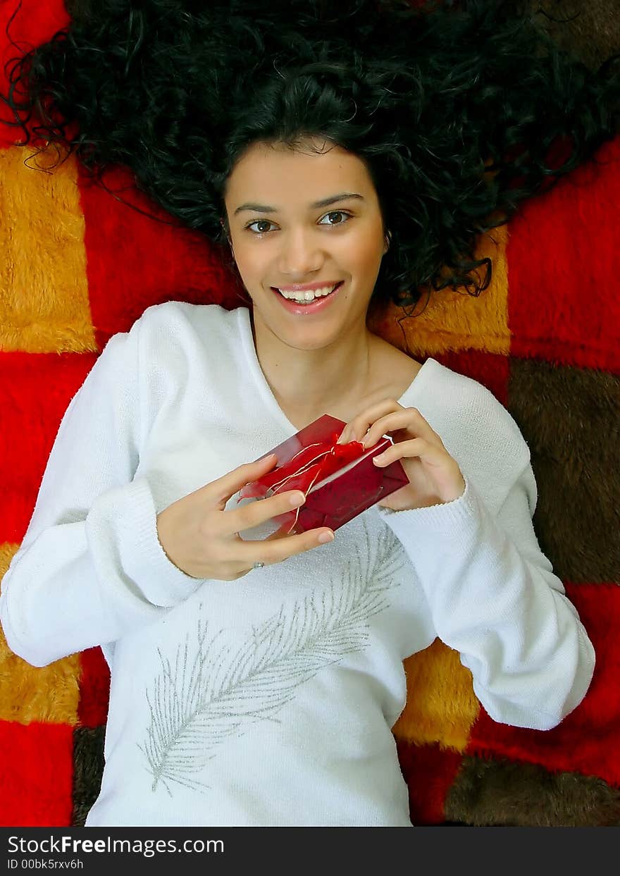 Young beautiful girl with gift