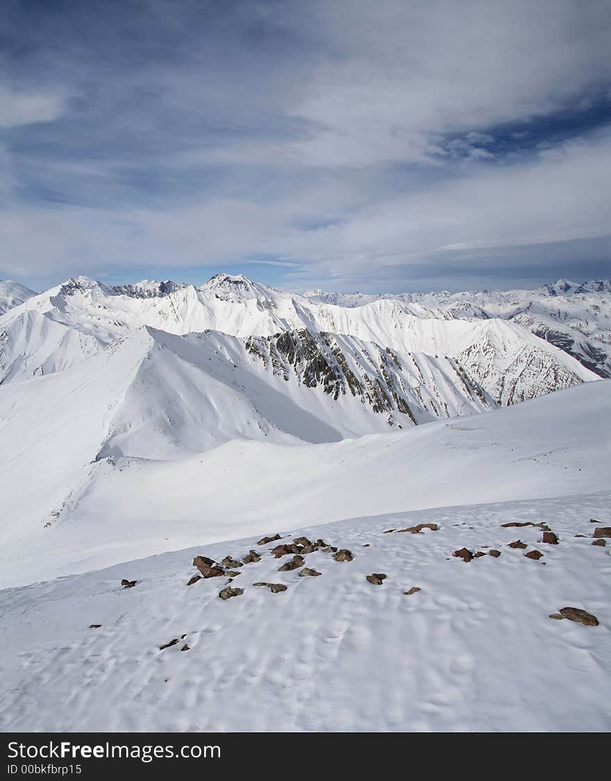 Mountain peaks in Georgia, near Gudauri ski resort.  View is from Sutzelly Mountain. Mountain peaks in Georgia, near Gudauri ski resort.  View is from Sutzelly Mountain.