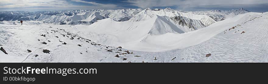 Mountain peaks in Georgia, near Gudauri ski resort.  Panoramic view is from Sutzelly Mountain. Mountain peaks in Georgia, near Gudauri ski resort.  Panoramic view is from Sutzelly Mountain.