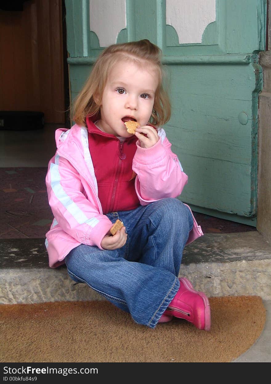 Girl sitting at the doorstep. Girl sitting at the doorstep