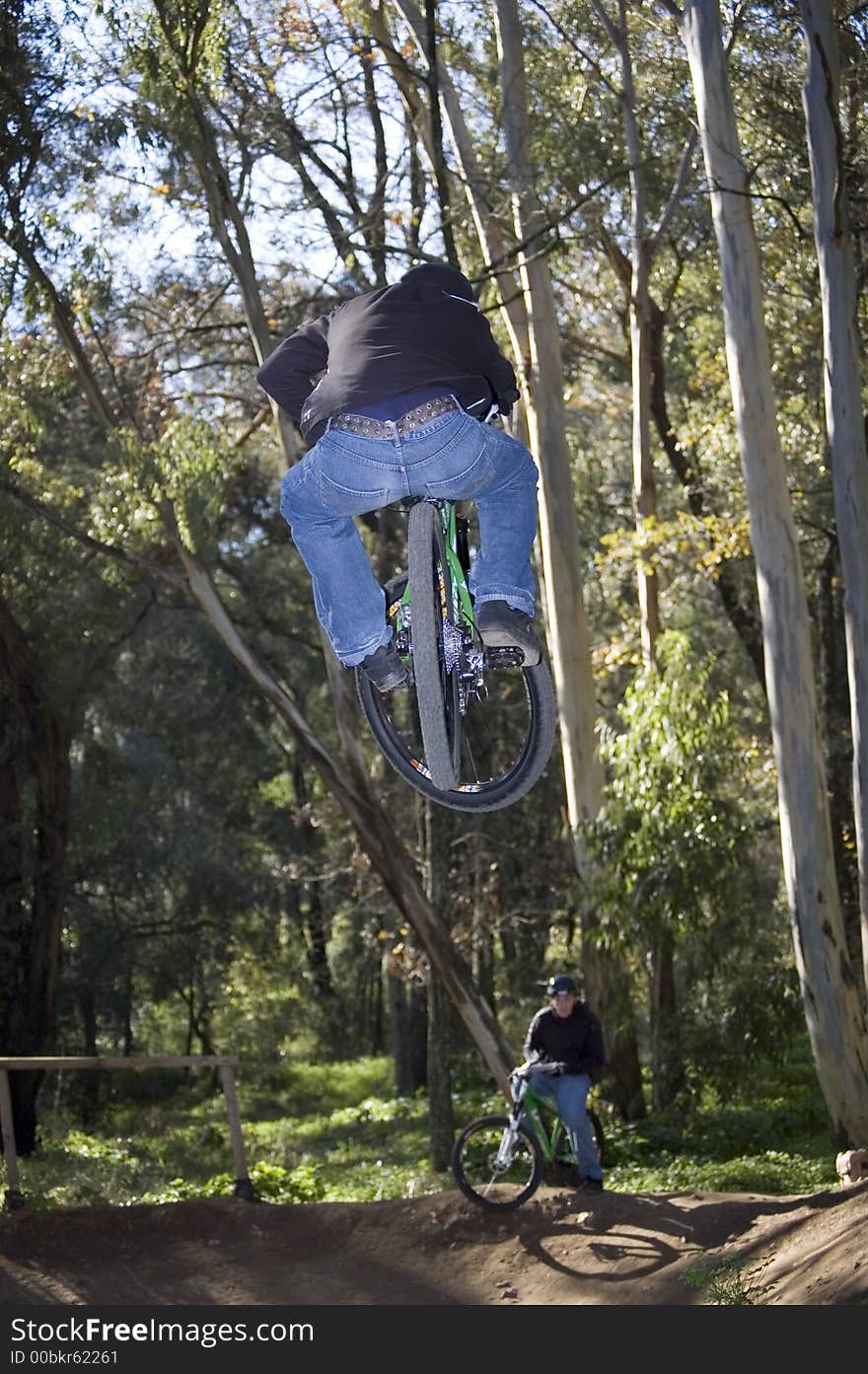 Extreme riders flying with they bikes. Extreme riders flying with they bikes