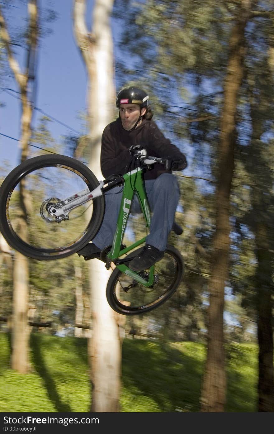 Panning of a rider flying in table top. Panning of a rider flying in table top