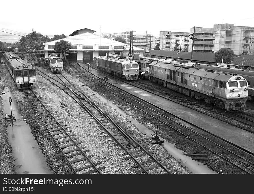 Trains at the railway station of Had Yai in the south of Thailand on a rainy day. Black and white photo. Trains at the railway station of Had Yai in the south of Thailand on a rainy day. Black and white photo.