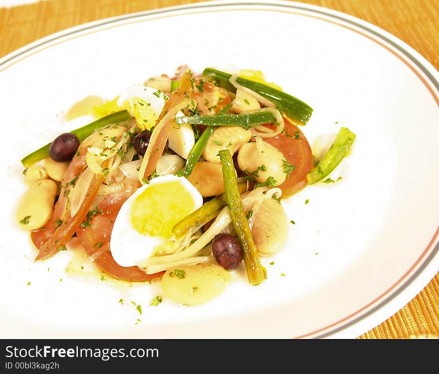 Fresh lima bean salad with hard boiled eggs and black olives