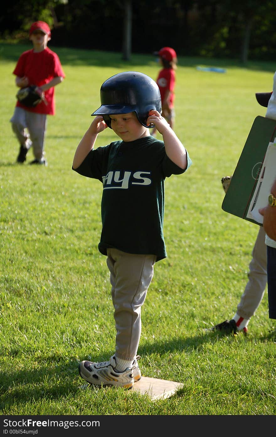 Five year old boy playing baseball. Five year old boy playing baseball.