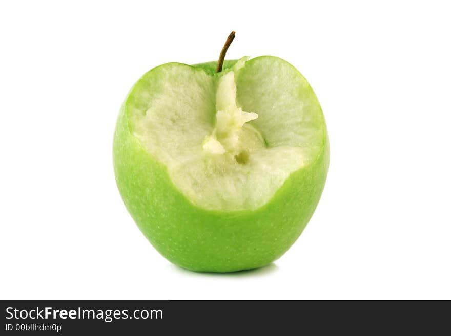 Bited green apple on a white background