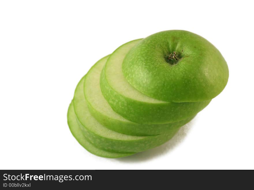 Green apple slices on a white background