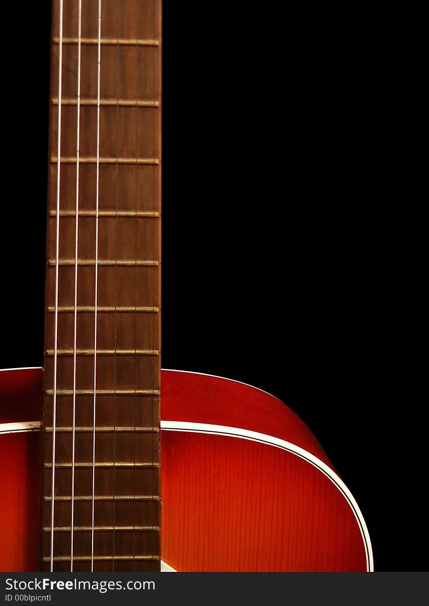 Acoustic guitar on black background. Macro. Close up. Acoustic guitar on black background. Macro. Close up.