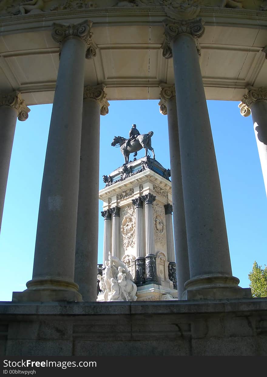 Collonade and equesrian statue against clear blue sky in Spain. Collonade and equesrian statue against clear blue sky in Spain