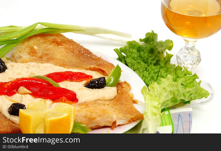 Fish recipe and white glass of wine