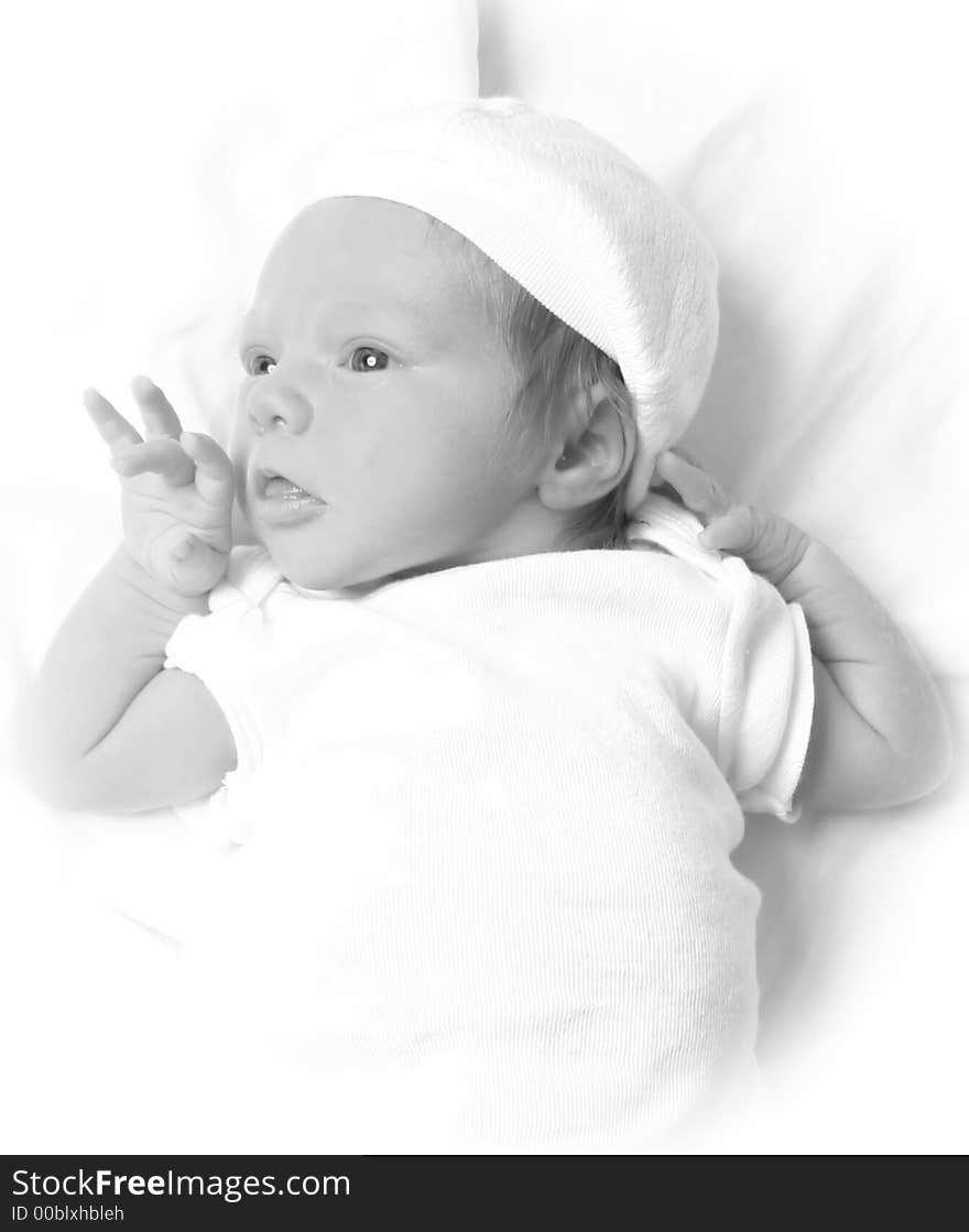 Infant laying on a white background. Infant laying on a white background.