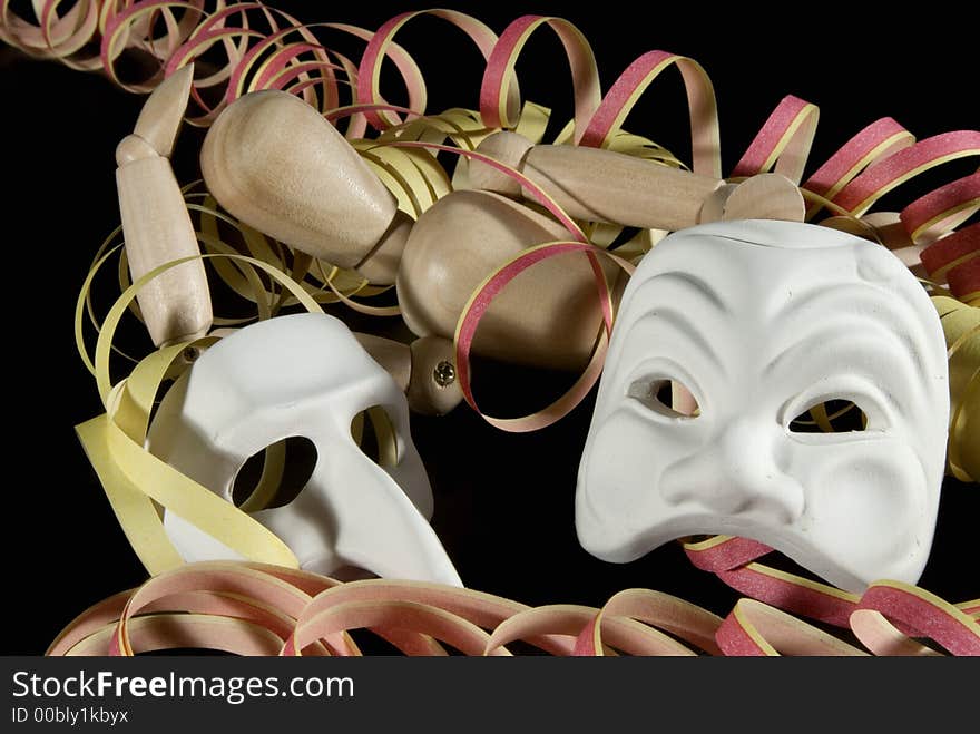 A wooden mannequin with some venetian carnival masks