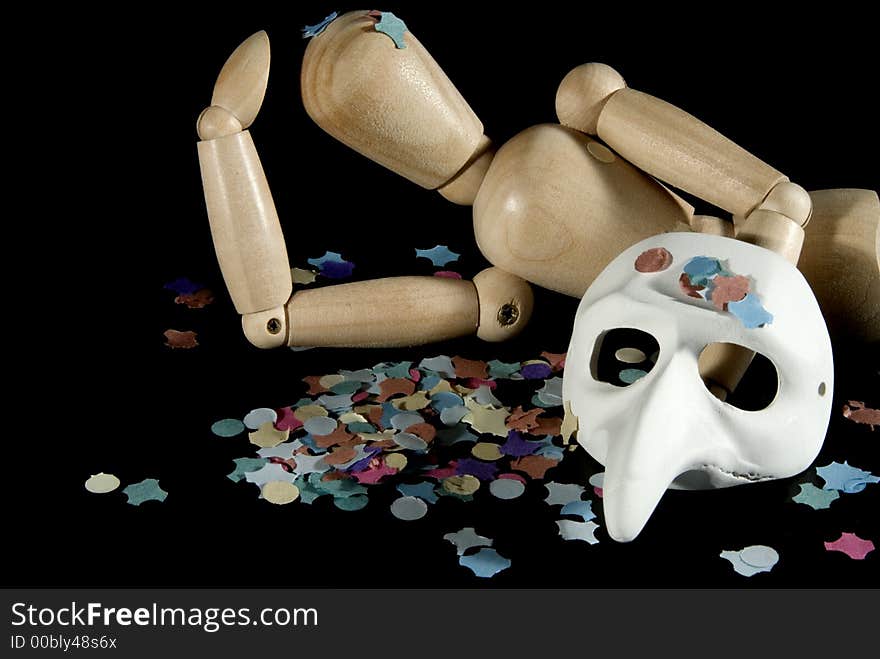 A wooden mannequin with some venetian carnival masks