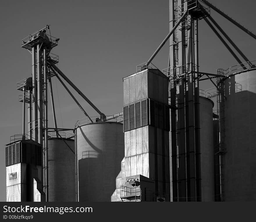 Black and white grain silos.