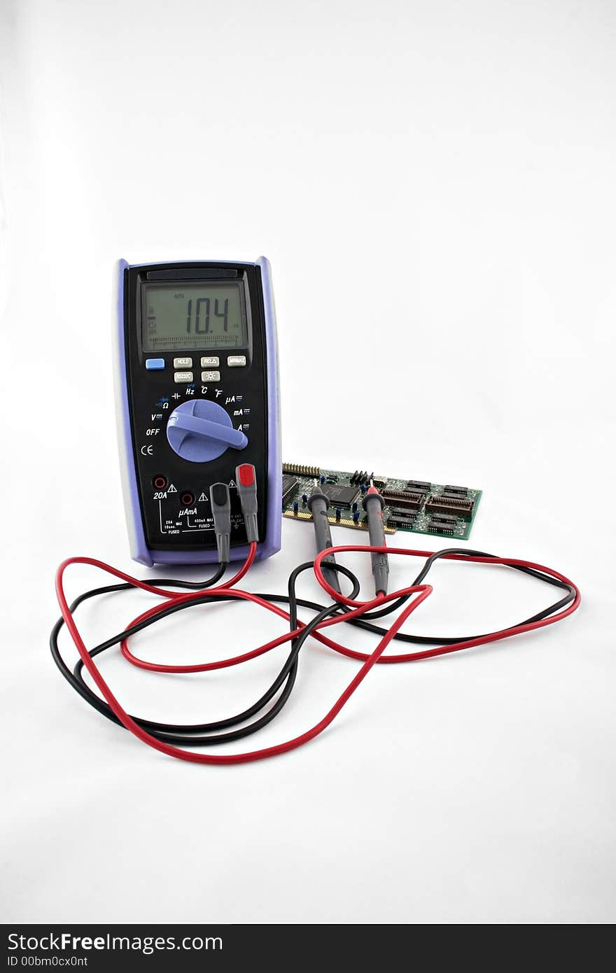 A digital multimeter with electronic circuit board isolated on white background.