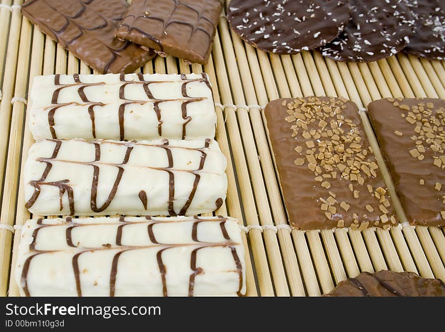 White chocolate cookies on bamboo sheet.