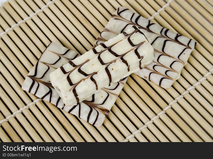 White chocolate cookies on bamboo sheet. White chocolate cookies on bamboo sheet.