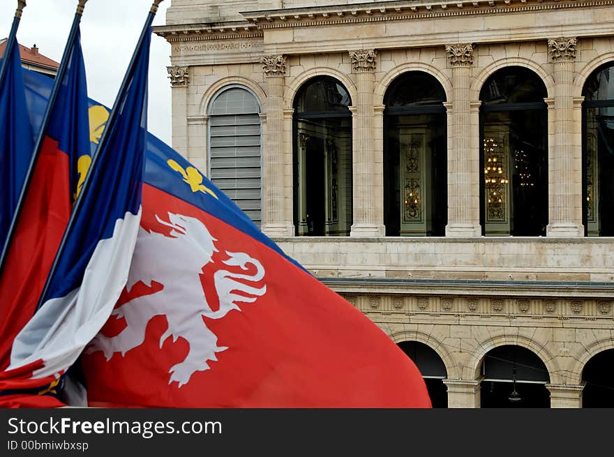 Lyon flag, with the opera building in the background. Lyon flag, with the opera building in the background