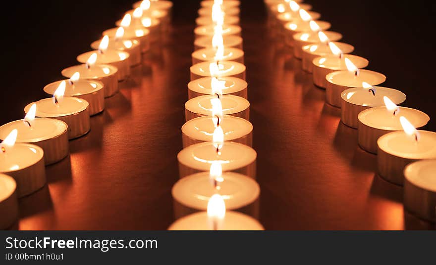 Candles set on gold to represent an infinte highway. Candles set on gold to represent an infinte highway.