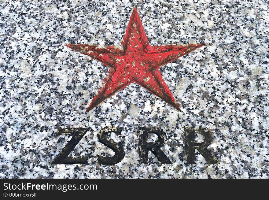 Stone memorial plaque with red star and zsrr sign