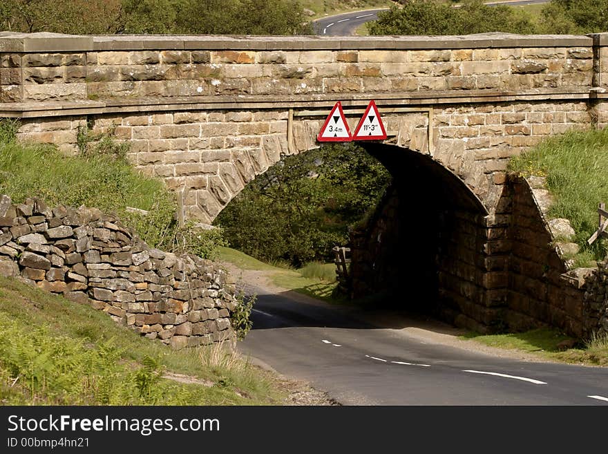 A low bridge on a country lane in North Yorkshire England.