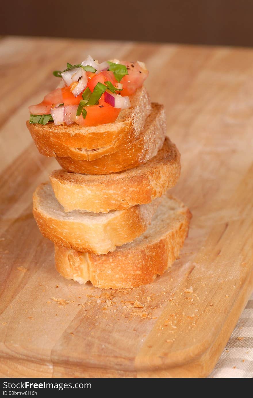 Stack of bruschetta on a cutting board