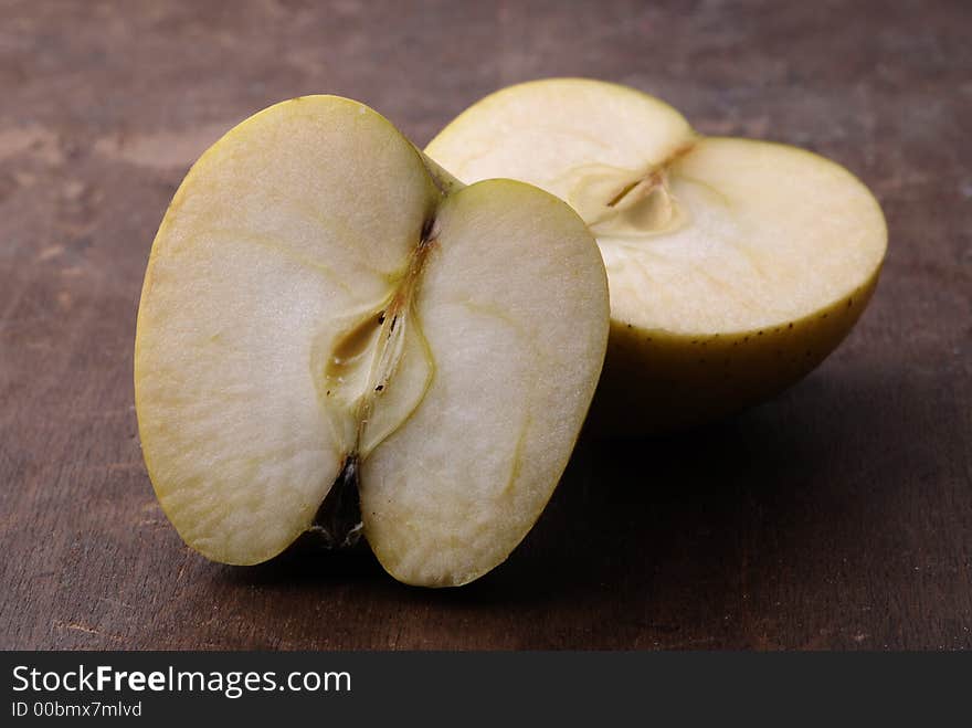 Apples on an aged wooden table/cutting board. Apples on an aged wooden table/cutting board.