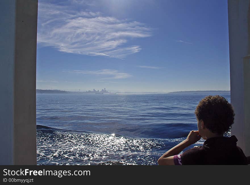 Kid checking out Seattle in the distance. Kid checking out Seattle in the distance