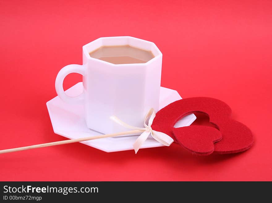 Fresh coffee topped with chocolate in the shape of a heart. Fresh coffee topped with chocolate in the shape of a heart