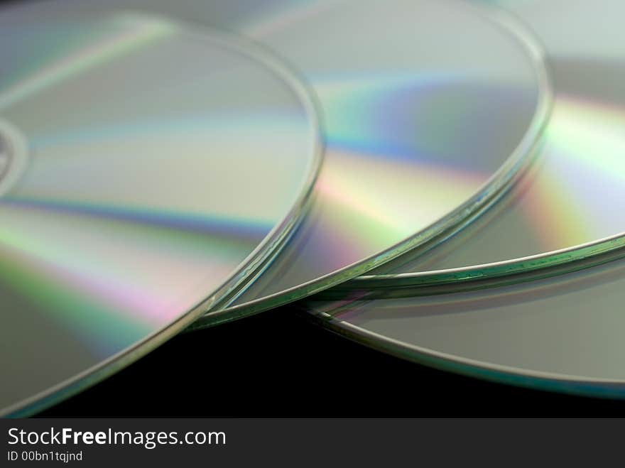 Closeup image of four CD disks. Closeup image of four CD disks.