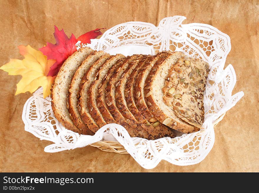 Bread and autumn leaves on a basket. Bread and autumn leaves on a basket