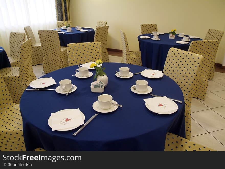 Blue tables and yellow chairs in italian restaurant. Blue tables and yellow chairs in italian restaurant