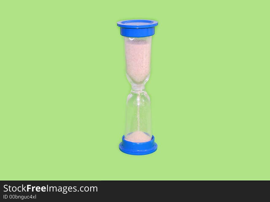 Hourglass counting the time isolated over green