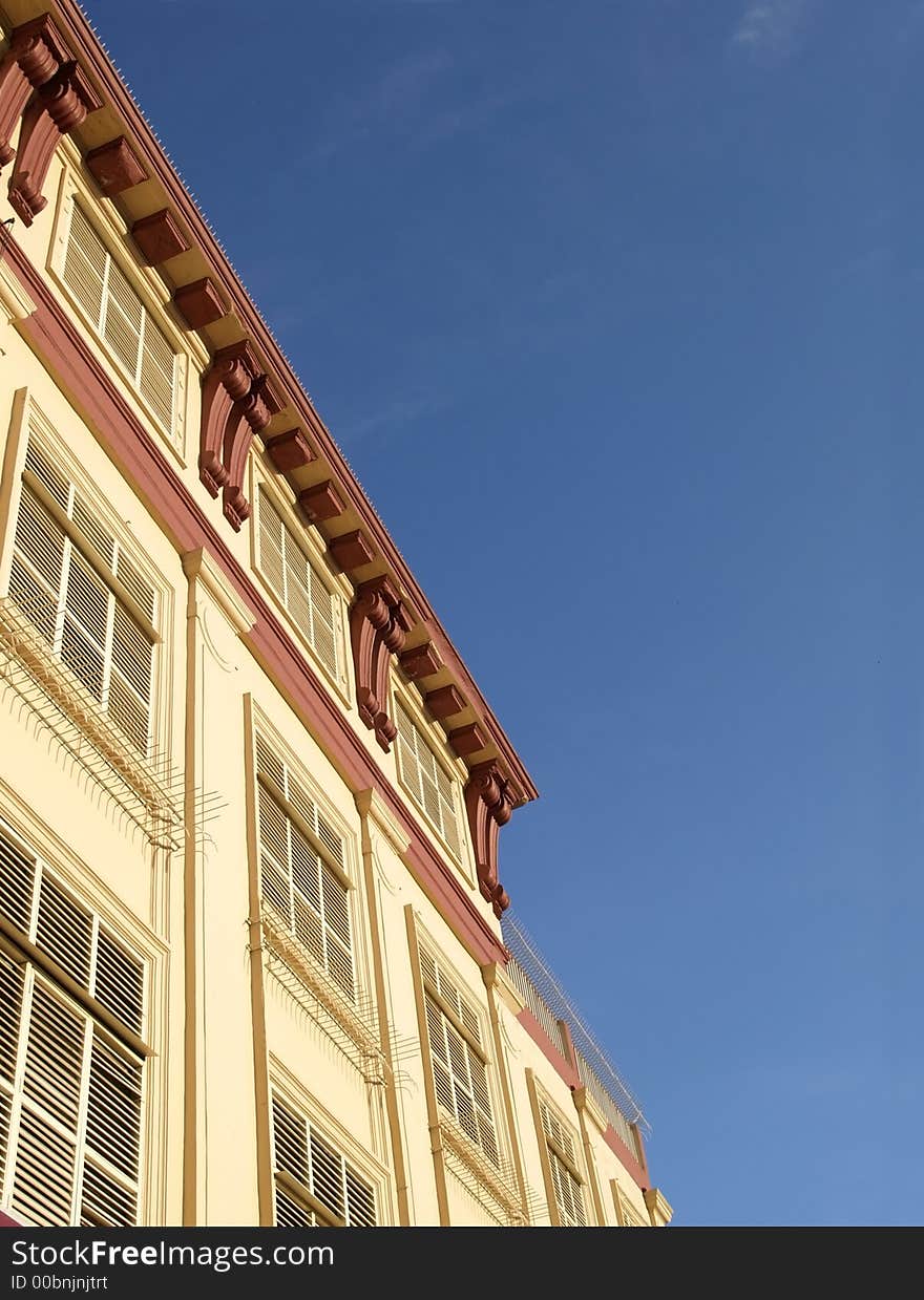 Detail of 19th century style urban building with blinds.