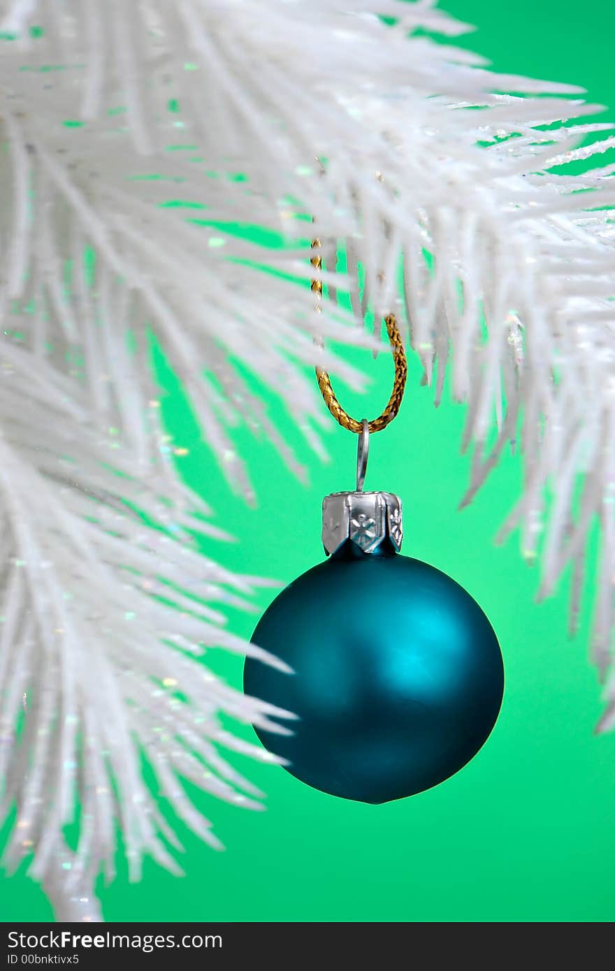 Blue Christmas Ornament hanging on a tree branch. Blue Christmas Ornament hanging on a tree branch.