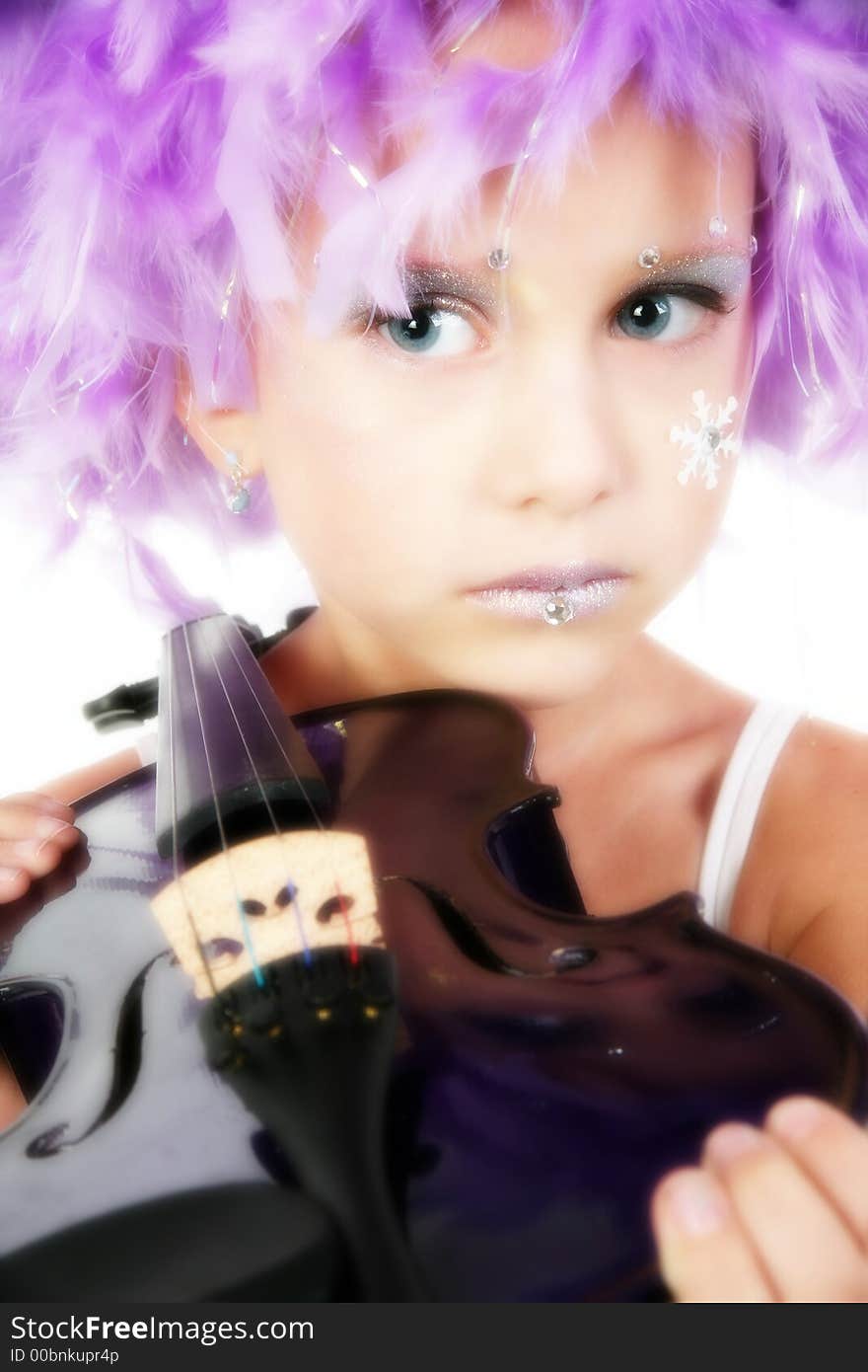 Beuatiful five year old girl in artistic make-up, purple feather wig, purple violin. Beuatiful five year old girl in artistic make-up, purple feather wig, purple violin.
