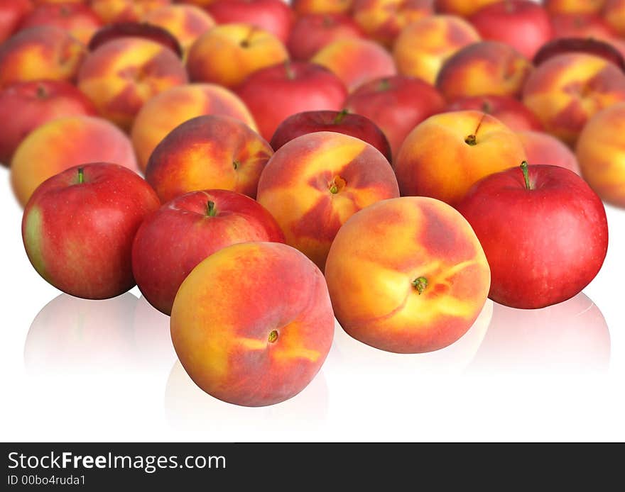 Peaches and red apples on light background