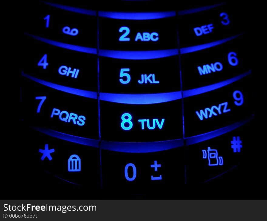 Cellular phone keyboard blue in the night