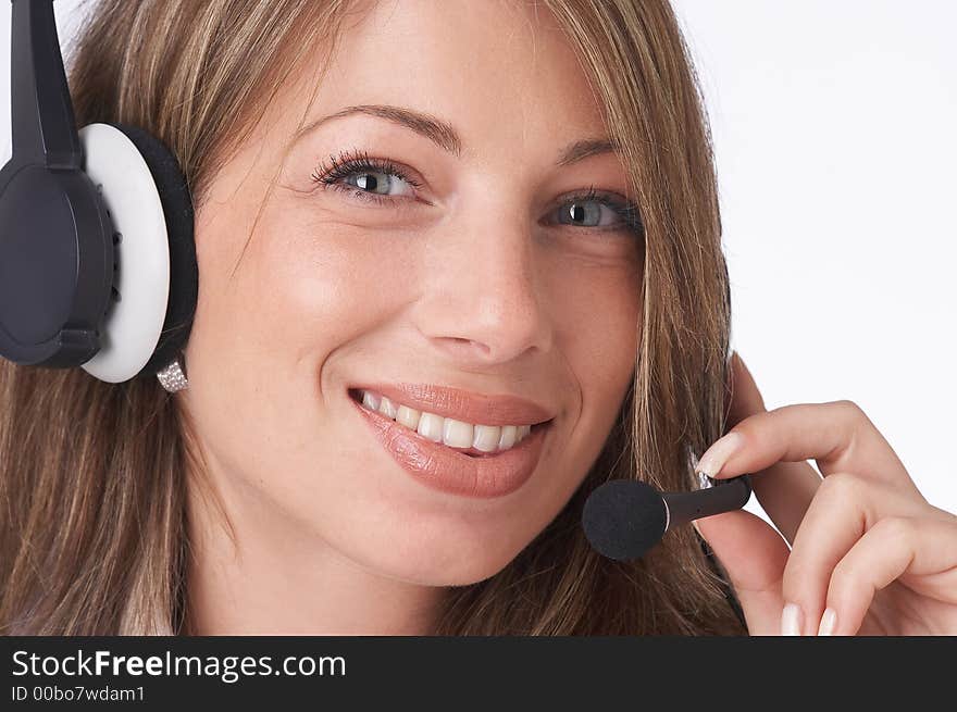 Smiling female operator with headset looking at the camera. Smiling female operator with headset looking at the camera