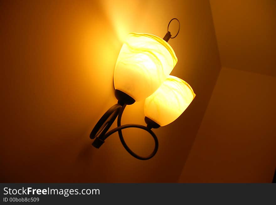 Vintage lamp on wall; atmosperic interior shot