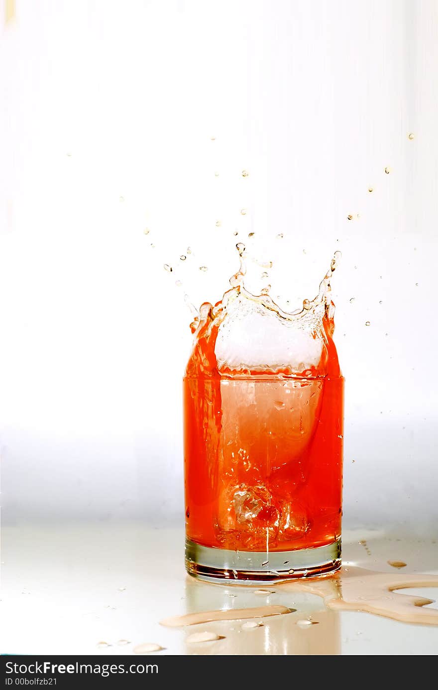 Fruit juice in a glass splashing making a pretty crown. Fruit juice in a glass splashing making a pretty crown